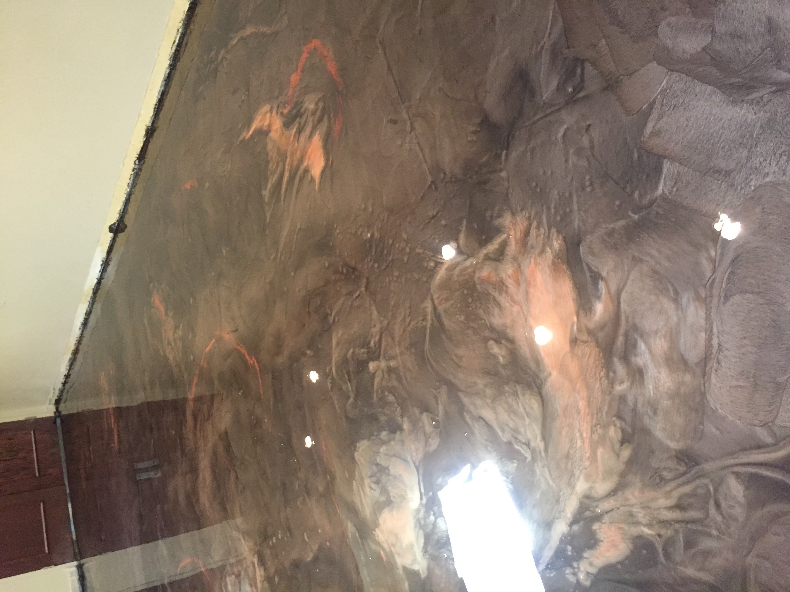 Dark copper metallic epoxy floor with swirl pattern Savannah GA